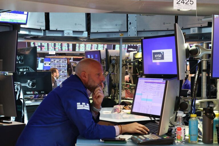 Stocks close lower ahead of highly anticipated earnings report from