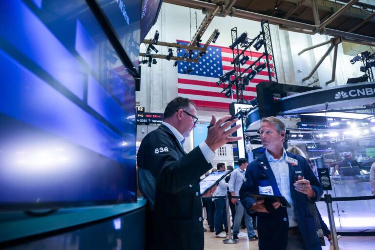 S&p 500 slips from record high as investors digest flurry