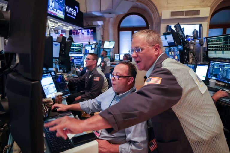 Stocks close little changed as major indexes hover near record