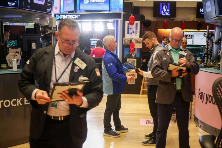 Dow slips as nasdaq closes at fresh record; tesla leads